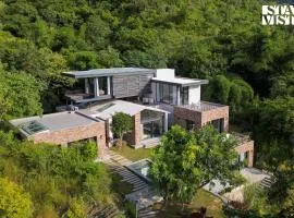 StayVista's Ikebana - Living By The Forest Edge - Mountain-view Villa with Infinity Pool, Lawn, & Indoor-Outdoor Games