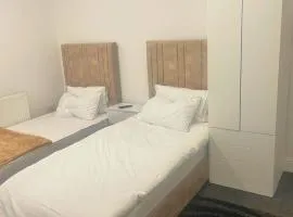 studio apartment with small kitchen and bathroom