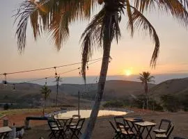 Espaço fazendinha por do Sol da piscina