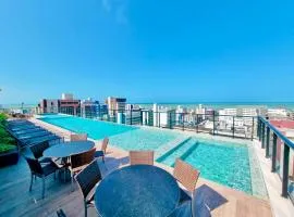 Flat com varanda e vista para o mar