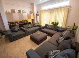 Luxury 4BHK Retreat with Netflix, Balcony & Family Stay