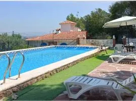 Bedroom with private bathroom One Bedroom Family Suite in forest with good view 80m2 large swimming pool in music city Lliria The garden and swimmingpool and garden are shared