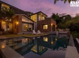 StayVista's Ikebana - Living By The Forest Edge - Mountain-view Villa with Infinity Pool, Lawn, & Indoor-Outdoor Games