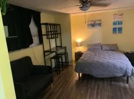 Private suite with small kitchen private bathroom entrance porch and driveway