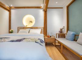 Qixia Guanjing Meisu Inn、麗江市のホテル