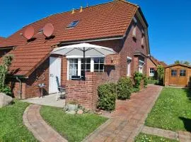 Ferienhaus Watt'n Glück - vollständig eingezäunt - in Neßmersiel