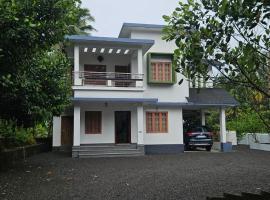 A cozy home bythe waterstream, tourist places near waynad โรงแรมในKodenchery