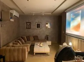 1BHK Apartment with Projector & Eiffel View Ideal Urban Retreat