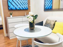 Modern Cozy 2BR Smart Lock Condo with Netflix 4K and YouTube Premium at Seawind, condo in Davao City