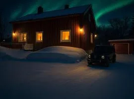 House in the lights and Aurora