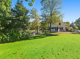 Modern Waterfront Retreat with Hot Tub & Pond Views