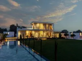 SaffronStays Raaga - luxury 4BR villa with private pool, lawns, gazebos & sweeping Aravalli hill views