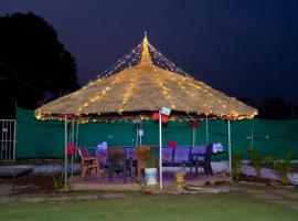 Trisha farmhouse, hotel en Titwala