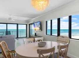 Updated direct oceanfront corner condo with large wrap-around balcony and heated pool