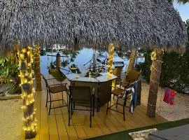 Waterfront Tiny House w Pool, Beach, and Boat Dock