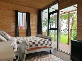 Valley view cabin in the woods on a farm