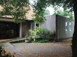 B&B Even Heukelom - Kamer met Tuin