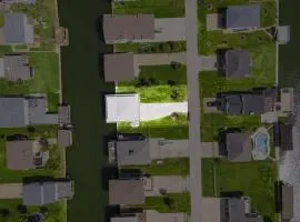 Texan Waterfront Retreat with Boat Slip, Fire Pit, Game Room and Outdoor Shower