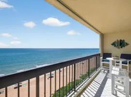 Renovated direct oceanfront condo with spacious balcony, heated pool, and garage parking