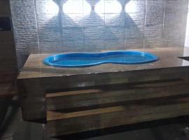 Casa super confortável para você e sua família, próximo a praia, hotel in Guarujá