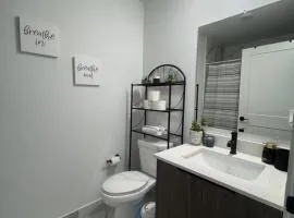 Modern room with kitchen and backyard access