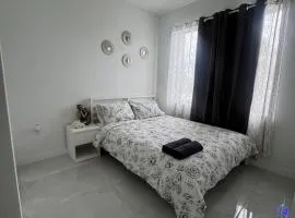 Modern room with kitchen and backyard access