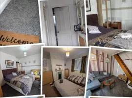 Close to City Center Bungalow walking distance to The Highcross, Abbey Park & Leicester City Long & Short Stays entire apartment with off road parking LE4