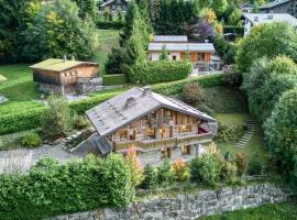 Luxury Chalet Black Mountain - 4BR, Sleeps 10, Fireplace, Mountain Views & Garden - Megève，位于梅杰夫的酒店