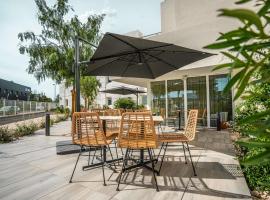 Greet hôtel Montpellier Aéroport Parc des Expos، فندق في موجيو