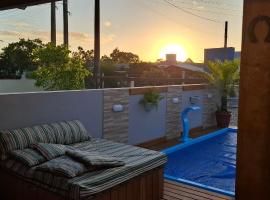 Casa aconchegante com piscina em Nova Tramandai, khách sạn ở Tramandaí