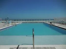 Beachside Bliss Ocean-View Condo with Pool and Private Beach Access Perfect for Families and Couples