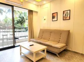 Relaxed 1BHK Retreat - Pool, Balcony, Secure Parking, Walk to Candolim Beach