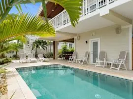 Entertainer's Backyard Oasis with Heated Pool, Putting Green, Bar, Grills, and Dock