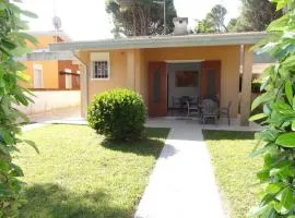 Family villa with private garden near the beach