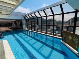 Guarujá Golden Beach 158 - Conforto com Piscina Climatizada, hotel i Guarujá