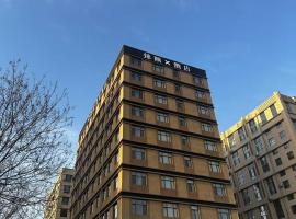 锦颐酒店呼和浩特东站店, hotel en Baita