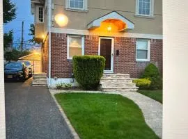 T Two Bedrooms House with Private Entrance, One block walk to UBS Arena!