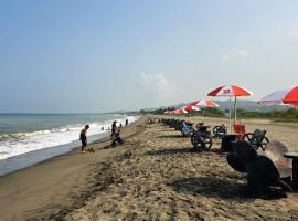 Beachfront Aircon Modern Bahay Kubo for 10 pax, hotel in Caba