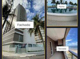 Apartamento frente á praia - vista incrível e conforto, hotel in Praia Grande