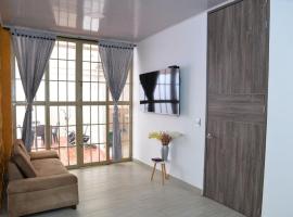 Casa Completa con parqueadero privado capacidad de hasta 8 personas, hotel en Ibagué