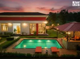 StayVista's Rustique Radiance - Hillside Retreat with Outdoor Pool & South Indian Architecture