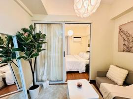 Prisma Residences by Kozy Mood near BGC, hotel que aceita animais de estima&ccedil;&atilde;o em Manilla