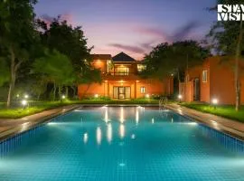 StayVista at Petals Of Dusk - Outdoor pool, WiFi & BBQ