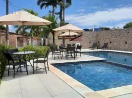 Casa 85 m2 no FORTE 2 quartos campinho piscinas 2 vagas no estacionamento portaria ar condicionado para 8 pessoas