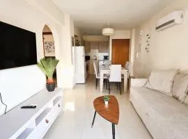 Sunny 2BR Getaway Steps from the Beach with Wi-Fi