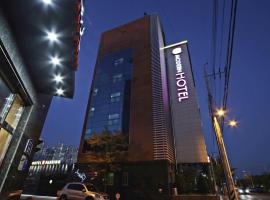 Modern Business Hotel, hotel di Gumi