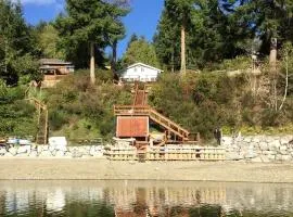 Amazing Sunrise at Coastal Luxury Cabin Rental on Herron Island with Fire Pit and Paddle Boarding near Olympia, Washington