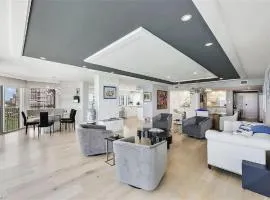 Sophisticated Three-Bedroom Coastal Apartment with Fireplace