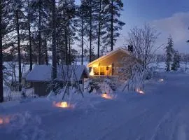 Villa Salme lemmikkiystävällinen mökki Taivalkoskella Jokijärven rannalla