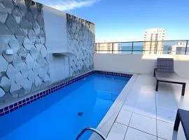 Apartamento a 300 metros da praia com piscina com vista para o mar